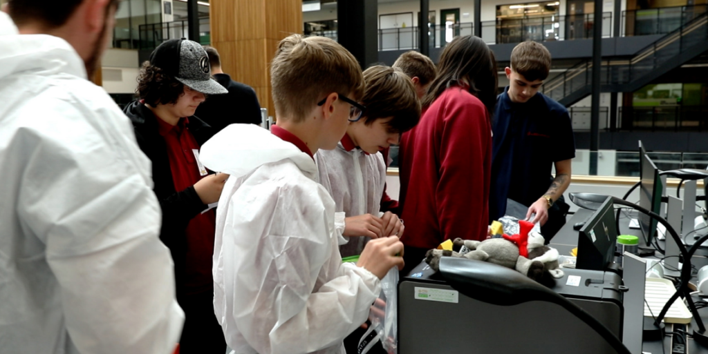 Children completing an activity at an unlock cyber event.